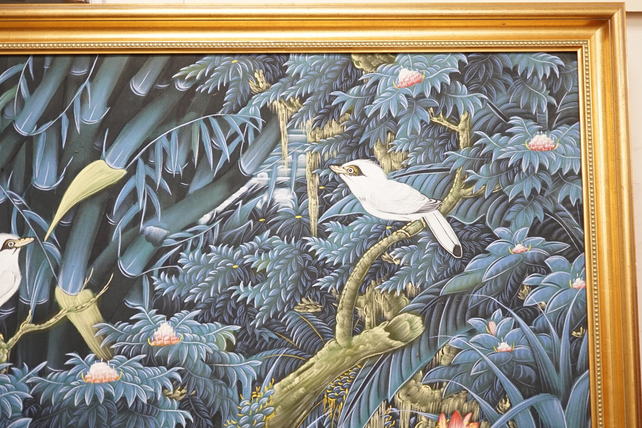 A modern Batik painting of birds amongst trees and flowers, 82 x 131cm